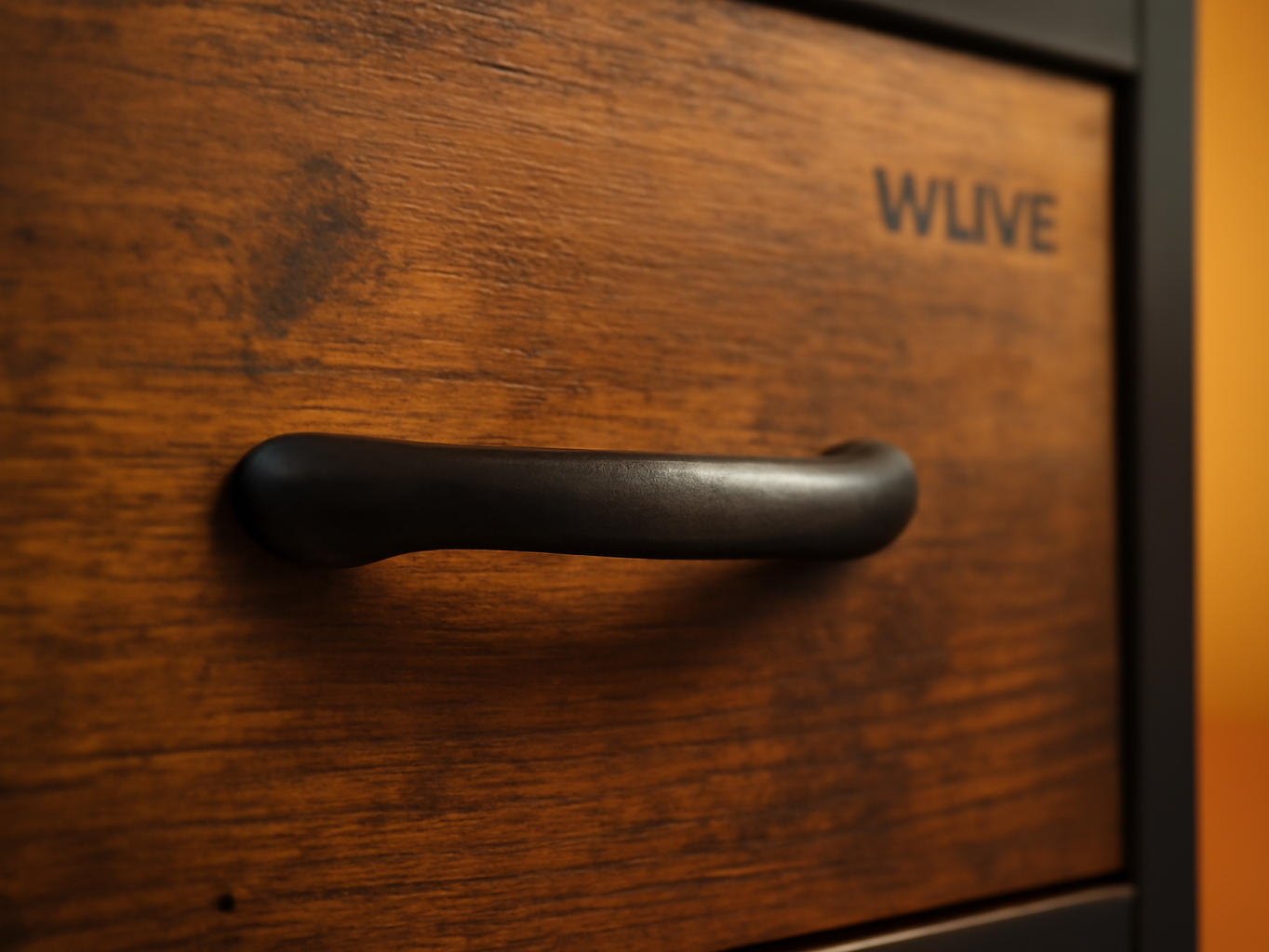 Close-up of rustic brown wood grain and metal drawer pull on the WLIVE dresser