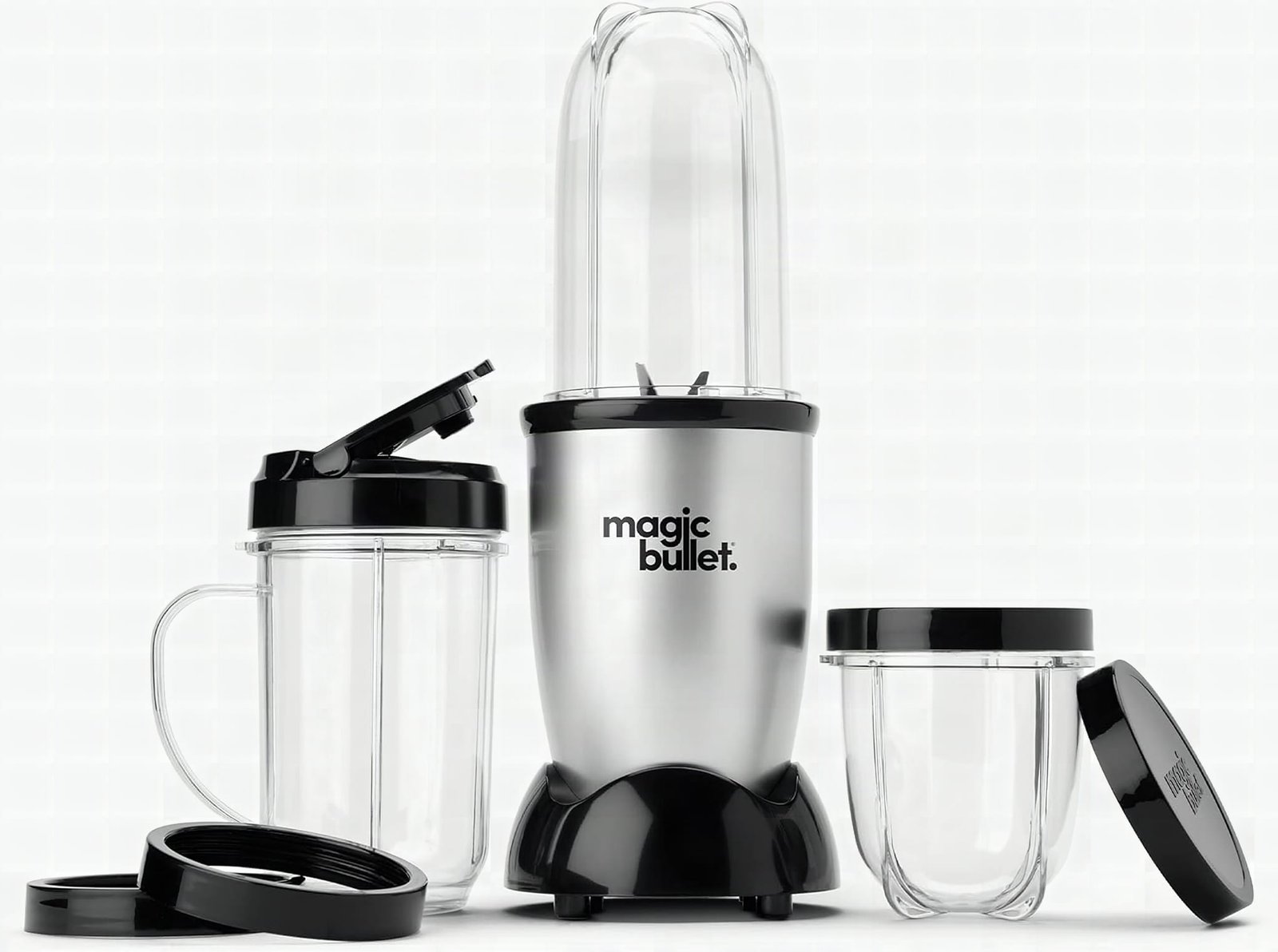 Magic Bullet blender motor base and stainless steel blades in extreme close-up, silver finish gleaming